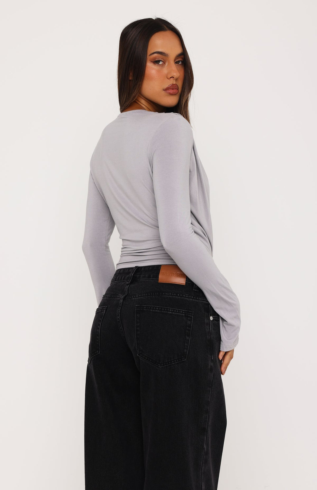 Glamcroft Long Sleeve Top with Plunge Neckline and Crossover Waist
